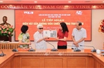 Lễ tiếp nhận hiện vật do Phóng viên chiến trường trao tặng Ban biên tập Ảnh - Thông tấn xã Việt Nam