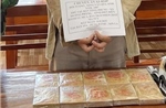 Bắt đối tượng mua, bán trái phép 10 bánh heroin