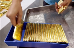 Vàng châu Á dưới ngưỡng 1.300 USD/ounce