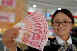 Trung Quốc ấn định tỷ giá NDT thấp nhất 4 năm