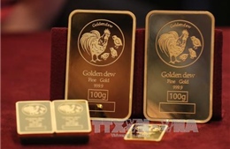 Giá vàng châu Á trượt dốc do đồng USD phục hồi