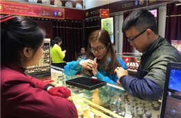 Giá vàng thế giới tăng, trong nước &#39;bình chân&#39;