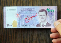 Đồng tiền Syria lần đầu tiên in hình Tổng thống Assad