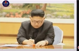 Truyền hình Triều Tiên lần đầu phát hình ảnh ông Kim Jong-un tận tay ký lệnh thử bom H 