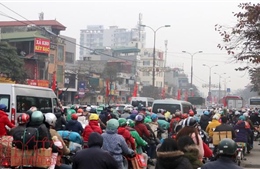 Xe máy ùn ùn về quê ăn Tết sau ngày làm việc cuối năm
