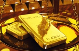 Giá vàng tiếp tục giảm, trên 1.320-1.330 USD/ounce