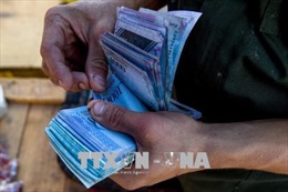 Venezuela tiến hành đổi tiền, giảm năm số 0