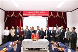 Tăng cường hợp tác giữa báo Nhân Dân và báo Pasaxon của Lào