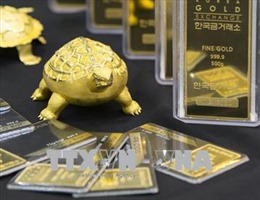 Chứng khoán Mỹ và đồng USD mạnh lên làm giảm sức hấp dẫn của vàng