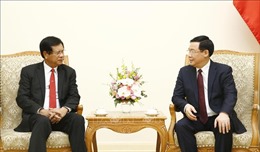Phó Thủ tướng Vương Đình Huệ chia sẻ kinh nghiệm phát triển hợp tác xã với nguyên Thủ tướng Lào