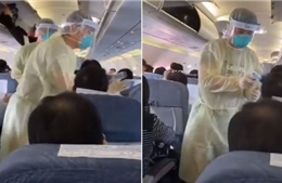 Nhân viên y tế kiểm tra thân nhiệt từng hành khách trên máy bay tại Vũ Hán