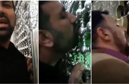 Bất chấp COVID-19, nhiều người Iran vẫn liếm cửa đền thờ