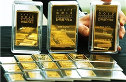 Đồng USD mạnh lên làm giảm sức hấp dẫn của giá vàng châu Á