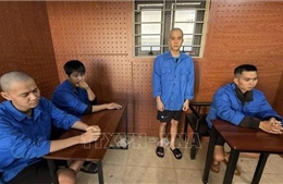 Bắt nhóm đối tượng mua bán trái phép súng quân dụng