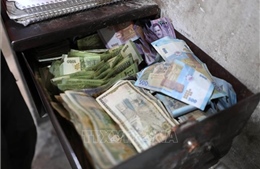 Syria bắt đầu đổi tiền