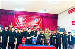 Bàn giao và tiễn đưa hài cốt liệt sĩ quân tình nguyện và chuyên gia Việt Nam hy sinh tại Nam Lào về nước