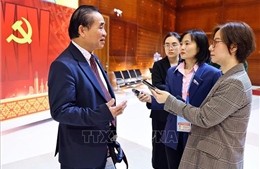 Phóng viên TTXVN tác nghiệp tại Đại hội XIV của Đảng