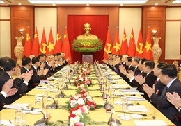 Báo chí Lào thông tin đậm nét về chuyến thăm cấp Nhà nước của Tổng Bí thư, Chủ tịch nước Trung Quốc đến Việt Nam