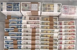 Đổi tiền lì xì cận Tết: Bẫy lừa đảo và rủi ro pháp lý