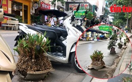 Ngang nhiên đặt vật cản giữa đường để giữ chỗ đỗ xe ở Hà Nội